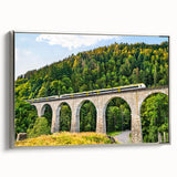 Framed canvas wall art featuring a serene landscape with railroad tracks, elegantly bordered in silver, perfect for enhancing home decor aesthetics.