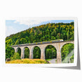 Landscape wall art print featuring a serene railroad scene with vibrant colors, rolled for easy transport and ready for framing, ideal for home decor enthusiasts.