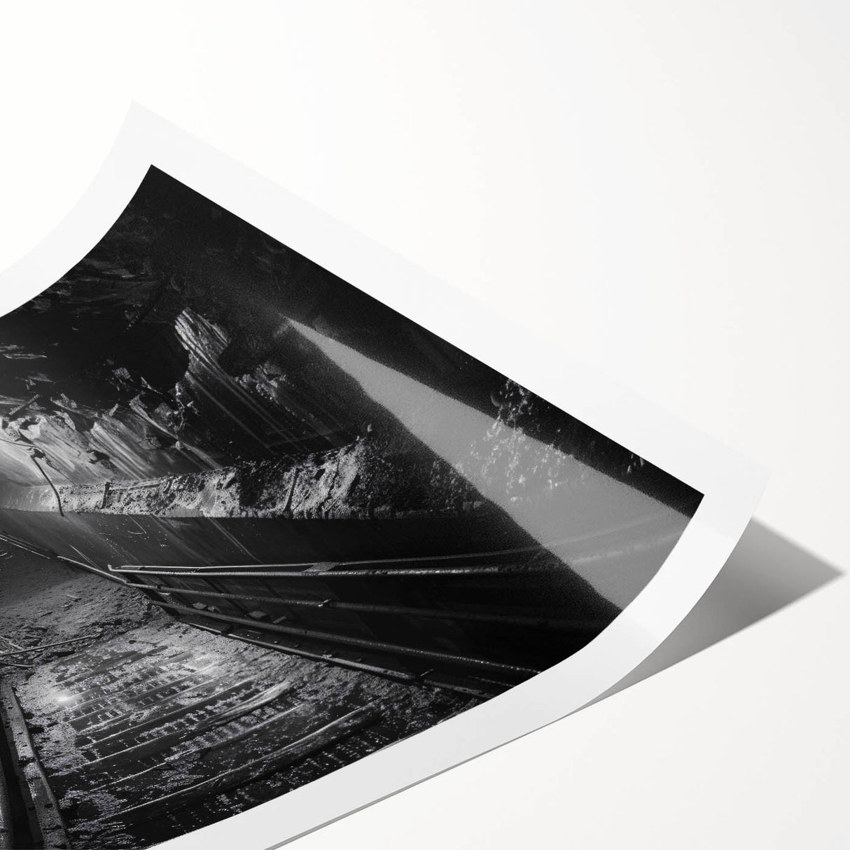 Rolled print showcasing a vibrant landscape featuring a railroad track meandering through lush green hills, ideal for home decor or art collection.