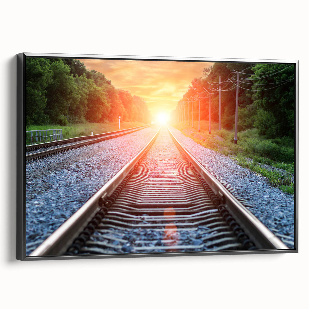 Framed canvas wall art depicting a scenic railroad landscape, featuring vibrant colors and intricate details, presented from a black side view to highlight its modern design.