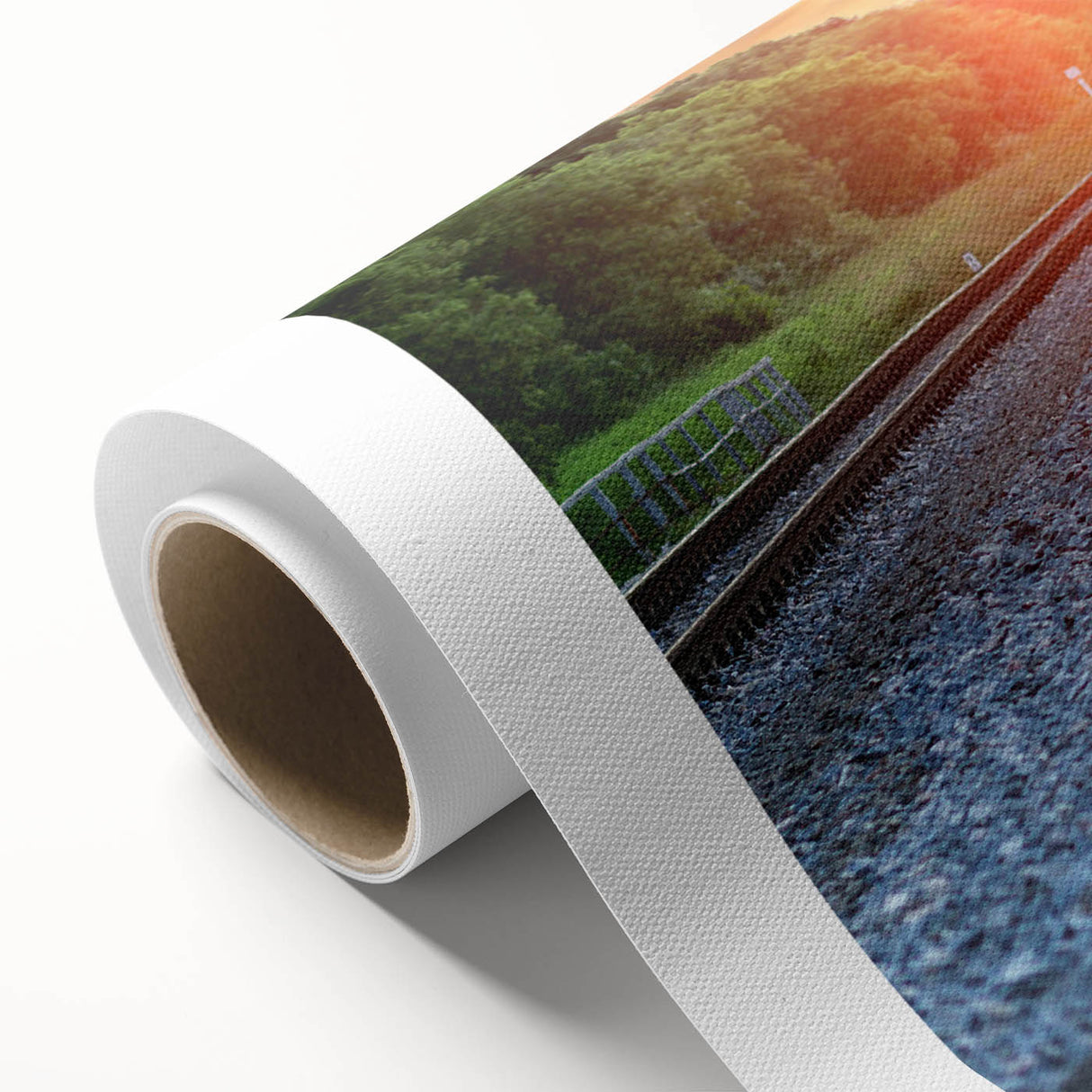 Rolled canvas artwork showcasing a vibrant landscape featuring a railroad scene with lush greenery and a blue sky, ideal for home or office decor.