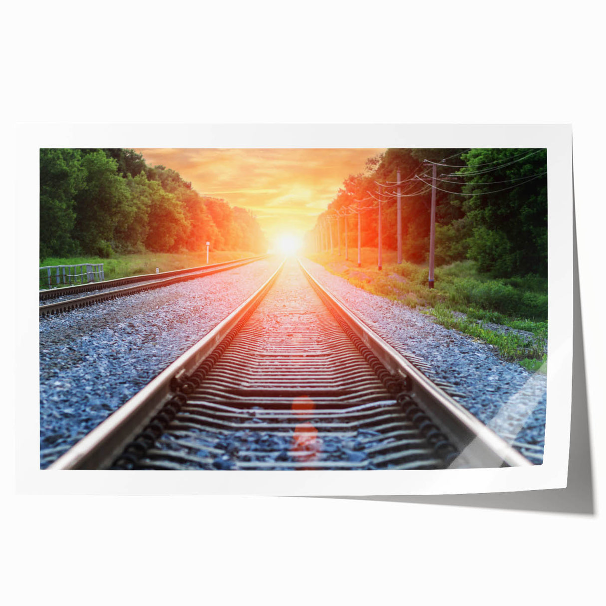 Vibrant rolled print of a scenic railroad landscape, showcasing lush greenery and a winding track under a bright blue sky. Ideal for home or office decor.