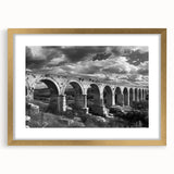 Elegant wall art collection featuring a framed landscape design with railroads, showcasing a gold frame and matting, ideal for enhancing home decor.
