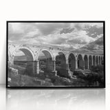 Framed acrylic wall art featuring a railroad landscape design, presented in a sleek black frame, perfect for enhancing home decor with a modern touch.