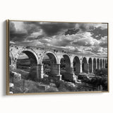 Framed canvas wall art showcasing a stunning landscape with railroads, highlighted by a gold frame, perfect for enhancing home decor with a touch of elegance.