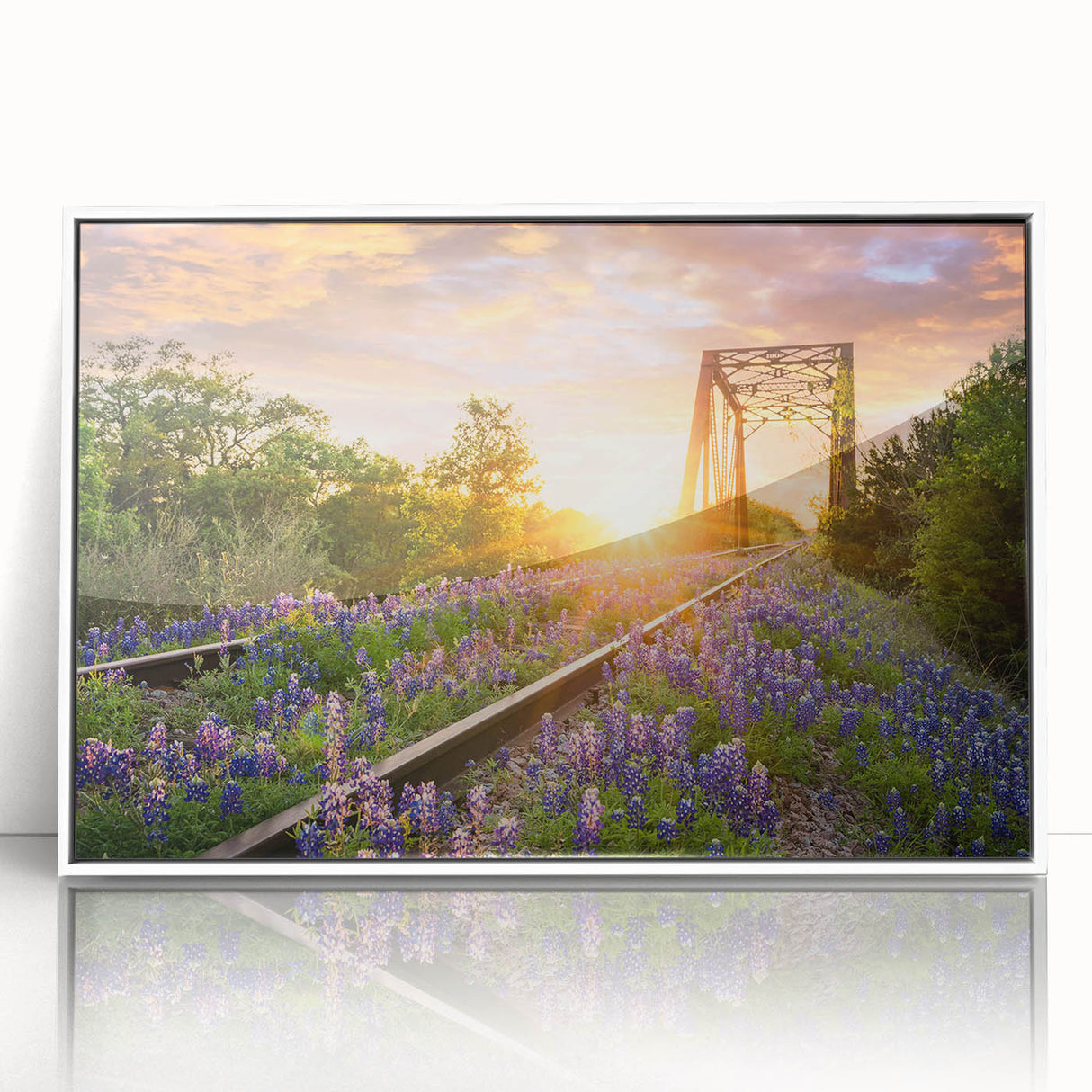 Framed wall art collection featuring a serene landscape with railroads, presented in a sleek white frame, ideal for modern home decor.
