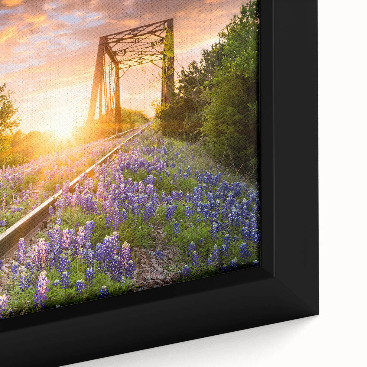 Close-up of a framed canvas wall art piece depicting a serene railroad landscape, showcasing vibrant colors and intricate details, perfect for home decor.