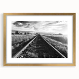 Framed wall art collection showcasing a scenic railroad landscape in a gold frame with a mat, ideal for enhancing home decor with a touch of elegance and nature.