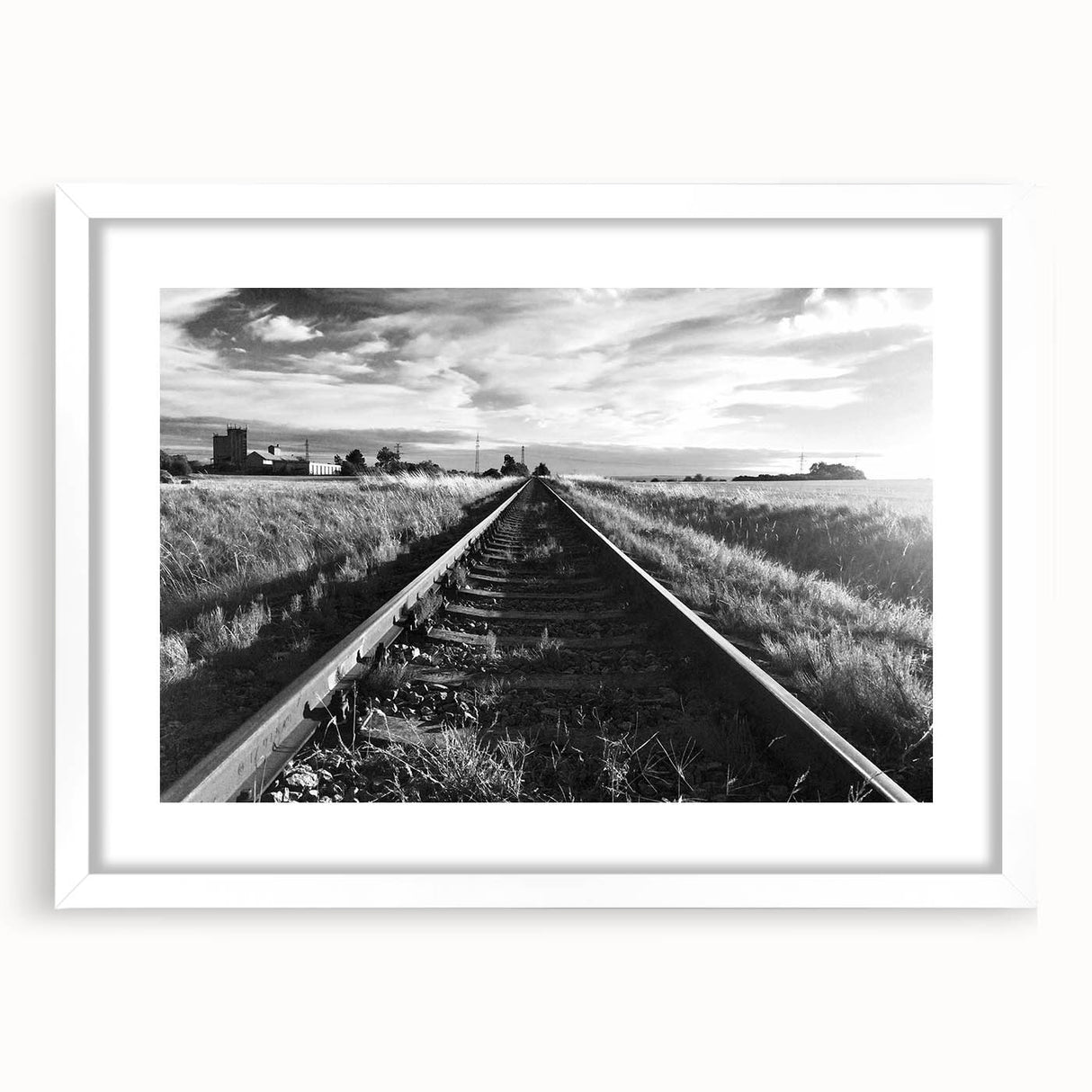 Framed wall art collection showcasing a scenic railroad landscape design, featuring a white mat and sleek frame, ideal for home or office decor. The artwork captures vibrant colors and intricate details, enhancing any living space with a touch of nature's beauty.