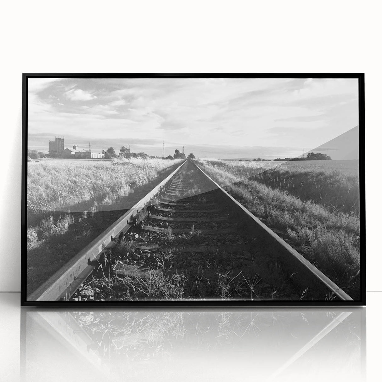 Framed acrylic wall art showcasing a vibrant landscape with railroads, featuring a sleek black frame. Ideal for modern home decor, adding depth and color to any space.