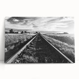 Stretched canvas wall art featuring a serene landscape with a railroad track winding through lush greenery, perfect for home decor or office ambiance. The vibrant colors and detailed scenery evoke a sense of tranquility and adventure, enhancing any interior space.