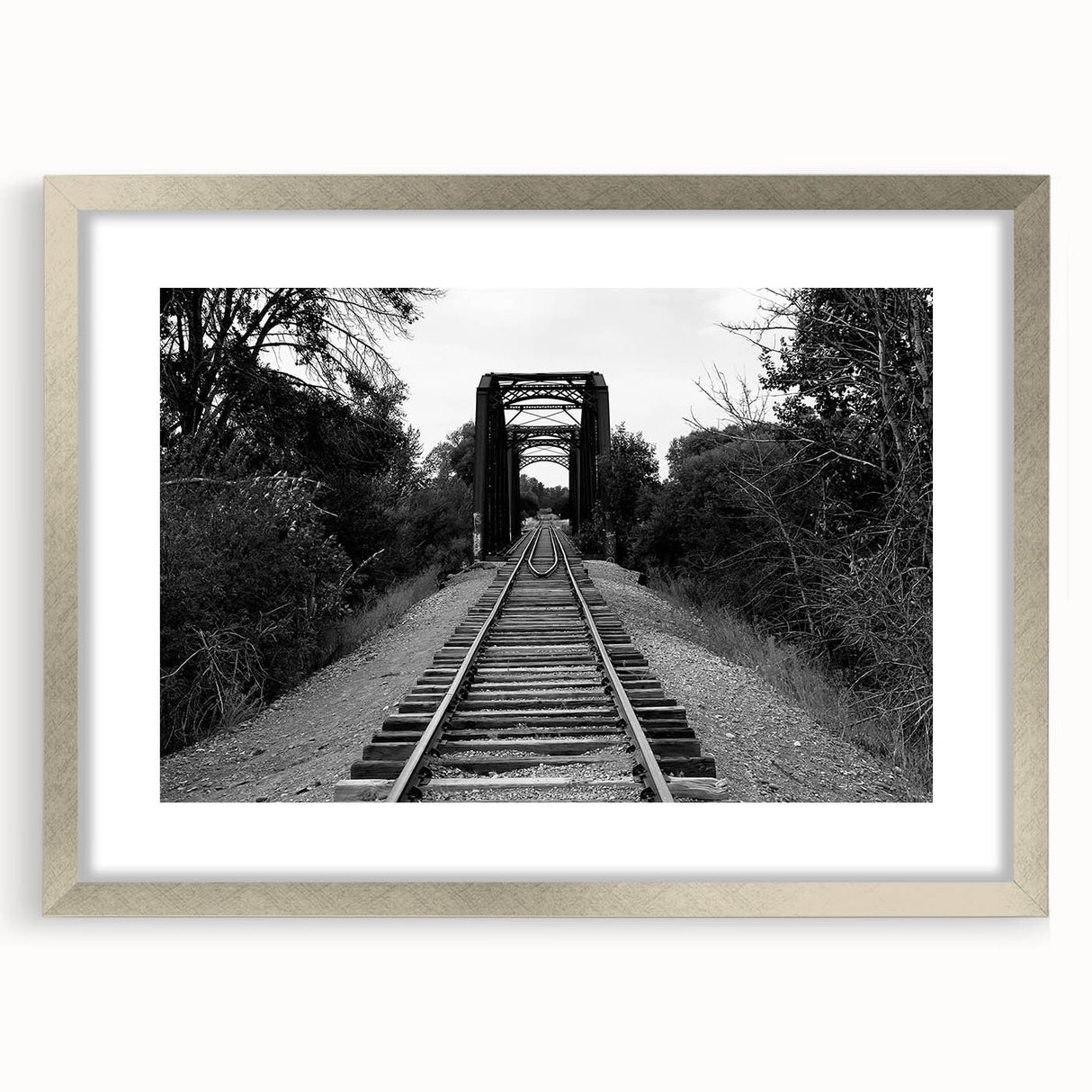 Framed wall art showcasing a stunning railroad landscape design in a silver frame with a mat, perfect for enhancing modern home decor. The artwork features vibrant colors and intricate details, ideal for enthusiasts of train history and scenic landscapes.