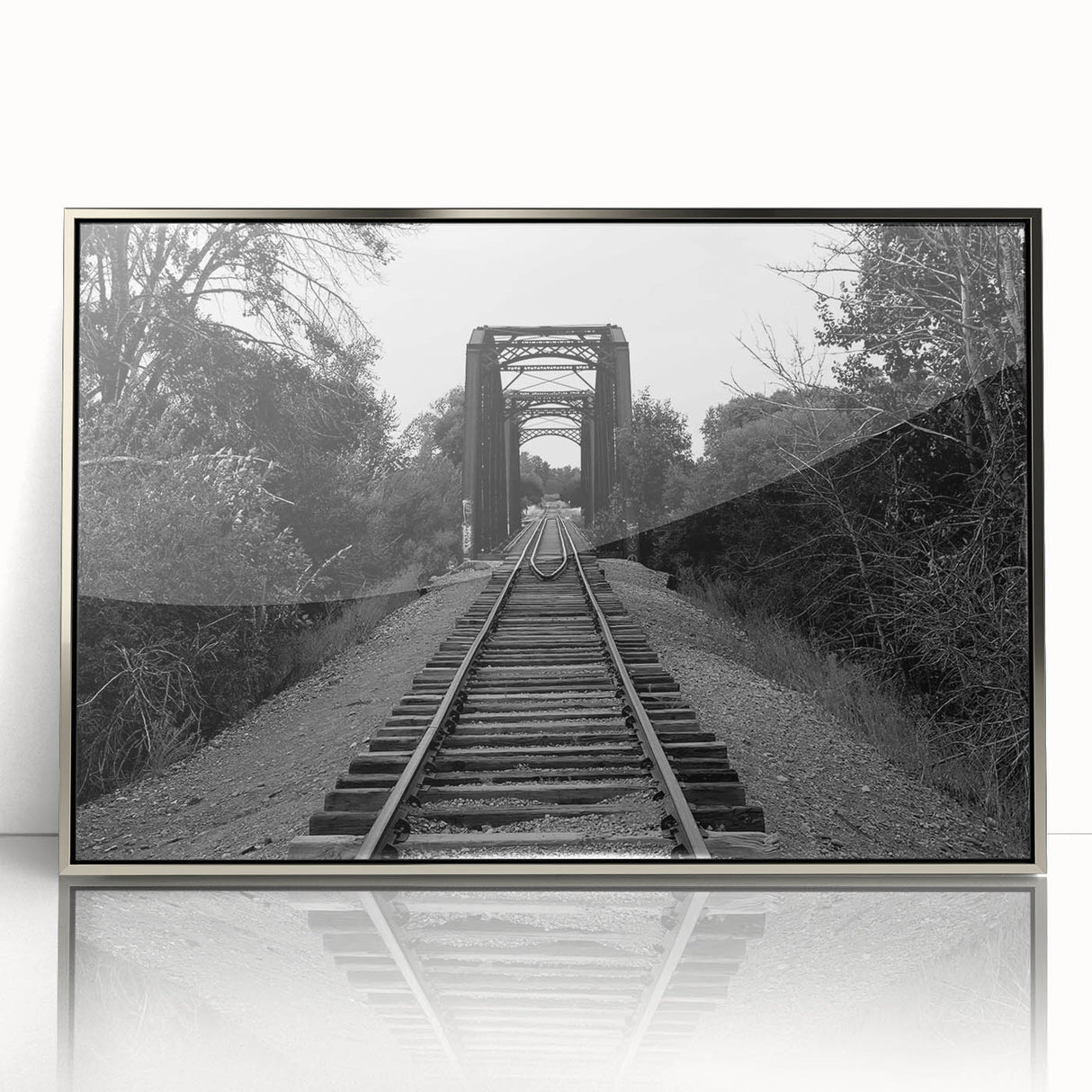 Framed acrylic wall art showcasing a stunning railroad landscape design in silver, highlighting intricate details and vibrant colors for elegant home decor.