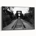 Framed black canvas wall art featuring a landscape railroad design, showcasing intricate details and vibrant colors, perfect for modern home decor.