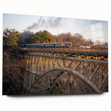 Acrylic glass wall art collection showcasing a vibrant landscape with a railroad theme, featuring rich colors and detailed textures, displayed elegantly from the side.