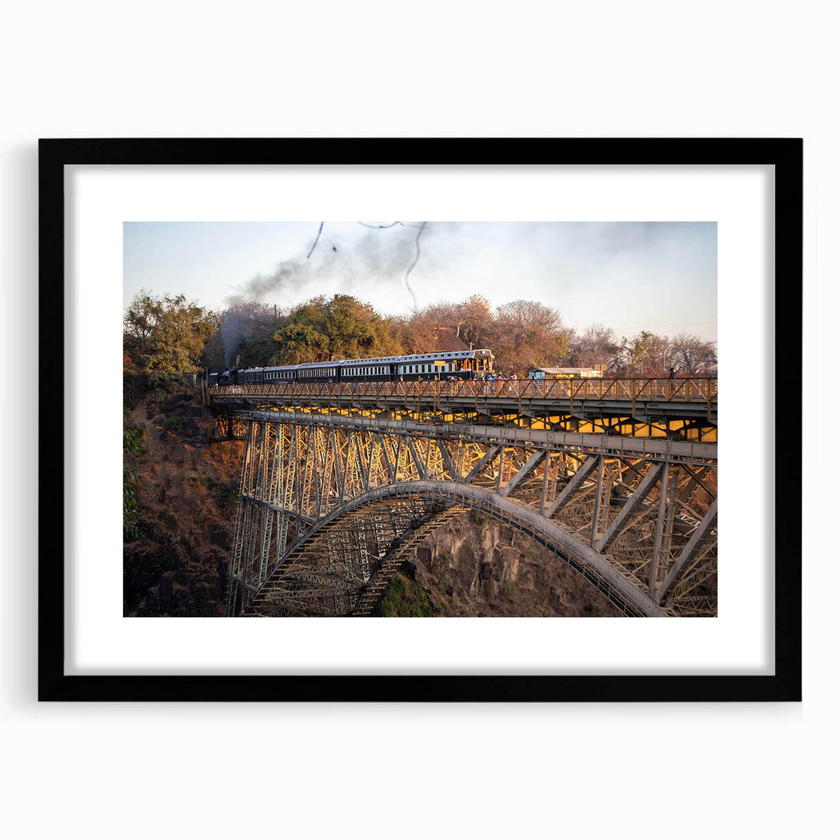 Framed landscape wall art featuring a serene railroad scene, with a black mat and sleek black frame, perfect for home decor and enhancing interior aesthetics.