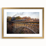 Gold-framed landscape wall art featuring a railroad design, elegantly matted for display. Ideal for enhancing interior decor with a touch of sophistication.
