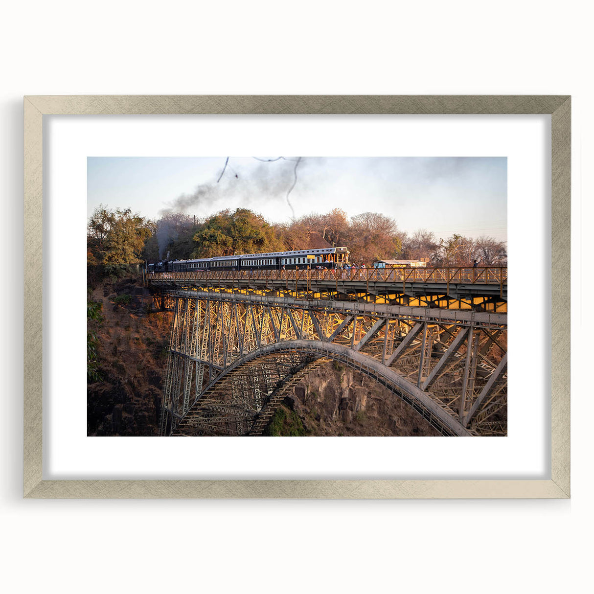 Framed silver wall art design showcasing a scenic railroad landscape, complete with a white mat, perfect for home decor and interior design enthusiasts.