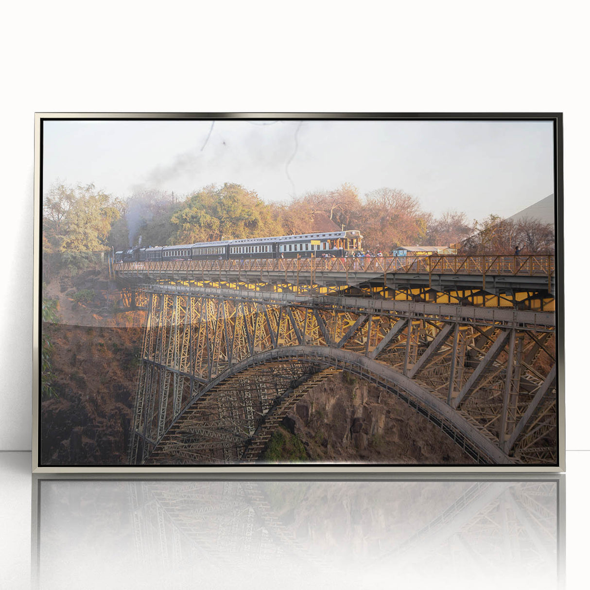 Framed wall art featuring an abstract landscape design with railroad tracks, showcasing vibrant colors and intricate details in a sleek silver frame. Perfect for modern decor.