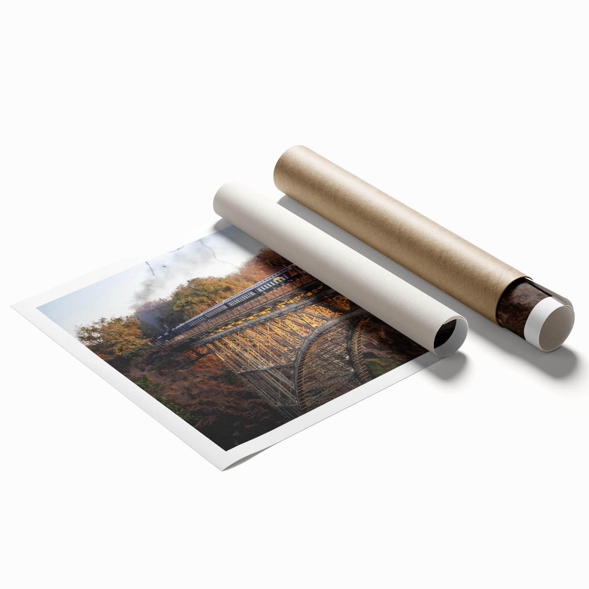 Vibrant rolled print showcasing a scenic railroad landscape with lush greenery and a clear blue sky, perfect for home or office decor. Ideal for art collectors.