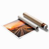 Vibrant rolled print showcasing a serene landscape with railroad tracks, featuring lush green trees and a clear blue sky, ideal for home decor and art enthusiasts.