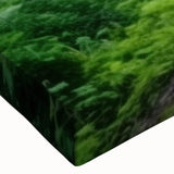 Close-up of a stretched canvas artwork depicting a vibrant landscape with railroads, showcasing rich colors and intricate details, perfect for home decor.