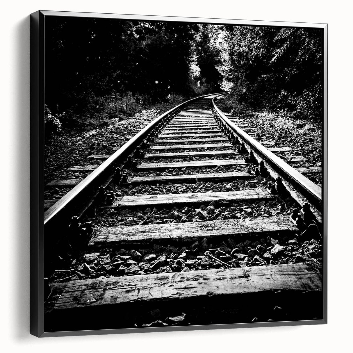 Framed canvas wall art collection showcasing a scenic railroad landscape design with vibrant colors, presented in a sleek black frame for a modern touch.
