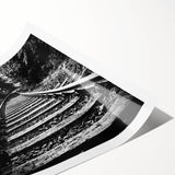 Rolled print showcasing a vibrant landscape featuring a scenic railroad, ideal for home decor, highlighting rich colors and intricate details on a textured surface.