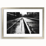 Framed silver wall art featuring a scenic railroad landscape design, complete with matting for a polished look. Ideal for enhancing home decor with a touch of elegance.