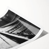 Rolled print of a vibrant landscape featuring a railroad scene, showcasing rich colors and intricate details, perfect for home decor or art collection.