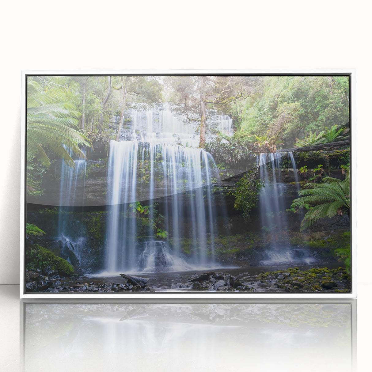 Framed acrylic wall art showcasing a vibrant rainforest landscape with lush greenery and a serene atmosphere, perfect for adding a touch of nature to home decor.