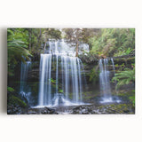 Stretched canvas wall art showcasing a vibrant rainforest landscape design with lush greenery and intricate details, perfect for enhancing any living space.