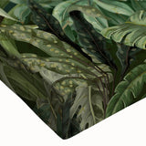 Close-up of a vibrant rainforest wall art design on stretched canvas, showcasing lush green foliage, exotic flowers, and intricate details for vibrant home decor.