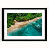 Black-framed rainforest wall art featuring vibrant green foliage and intricate jungle patterns, perfect for adding an exotic touch to home decor.