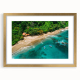 Framed rainforest landscape wall art with a gold mat, showcasing vibrant green foliage and natural elements, perfect for enhancing home decor and bringing nature indoors.