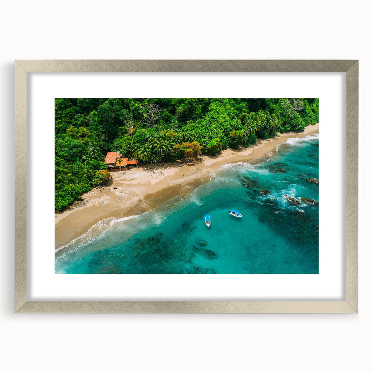 Framed rainforest landscape wall art design showcasing vibrant green foliage and intricate details, presented with a silver mat and frame for elegant decor.