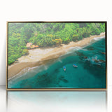 Framed acrylic wall art depicting a vibrant rainforest landscape, featuring lush green foliage and intricate details, accented with a sleek gold frame for an elegant touch.