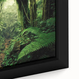 Close-up of a framed canvas print showcasing a vibrant rainforest landscape design, featuring lush green foliage and intricate details, perfect for home decor.