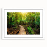 Framed rainforest landscape wall art design showcasing vibrant greens and blues, featuring a white mat for an elegant finish, perfect for home decor.