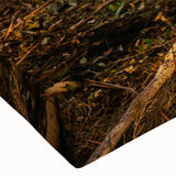 Close-up of a vibrant rainforest landscape wall art design on stretched canvas, showcasing rich greens and intricate details, perfect for nature-themed decor.