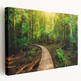 Stretched canvas wall art showcasing a vibrant rainforest landscape design with lush greenery and colorful wildlife, perfect for enhancing home decor.