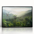 Framed acrylic wall art featuring a vibrant rainforest landscape design, showcasing lush greenery and serene natural beauty, presented in a sleek black frame for an elegant decor accent.