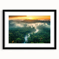Framed rainforest landscape wall art featuring vibrant greens and earthy tones, set in a sleek black frame with a mat, ideal for nature-themed decor.