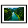 Framed rainforest landscape wall art featuring vibrant green hues and intricate details, set in a sleek black frame with a white mat, ideal for home decor.