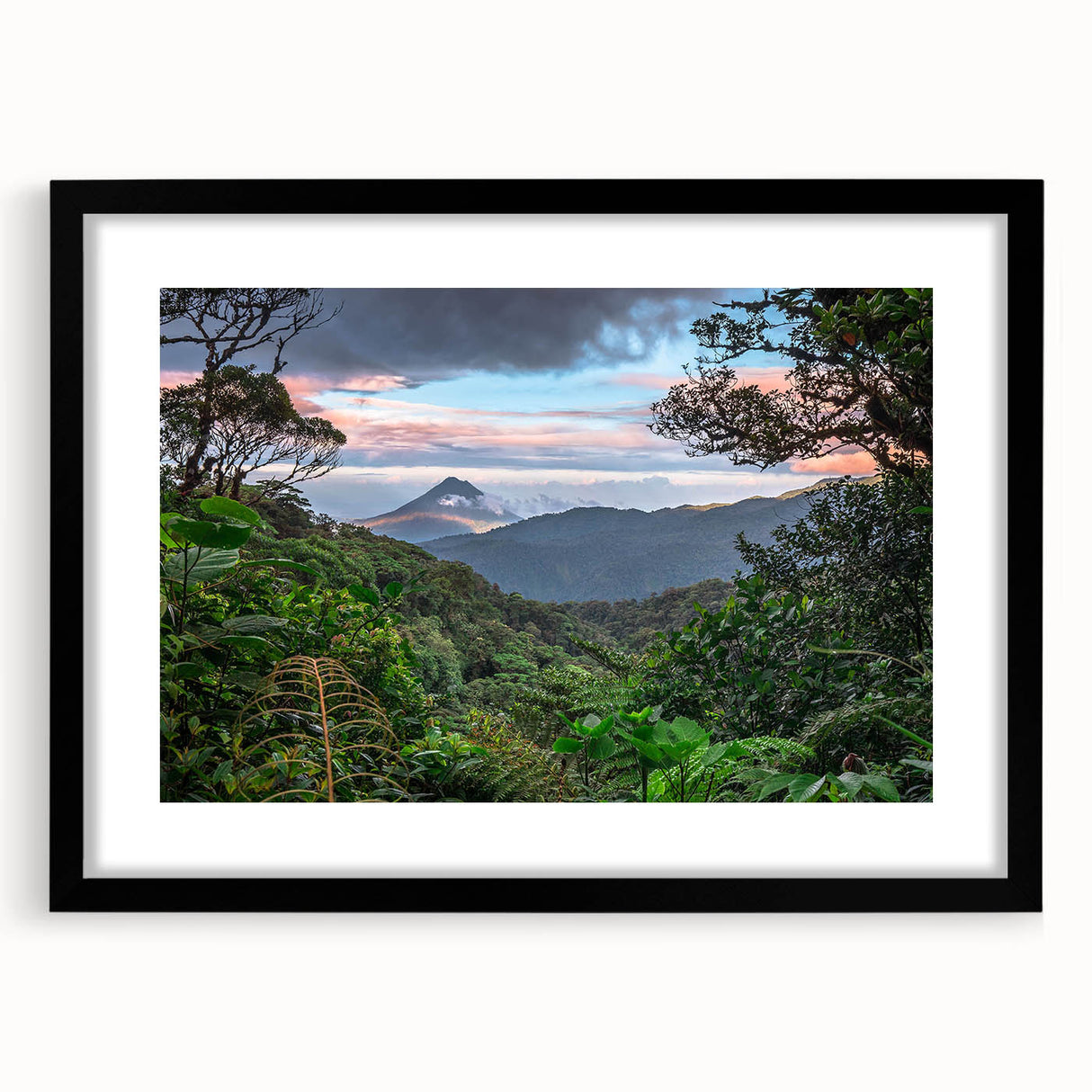 Framed rainforest landscape wall art featuring vibrant greens and earthy tones, designed to enhance home décor with a modern touch and elegant black mat.