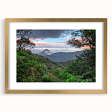 Framed rainforest landscape wall art collection with a gold mat and sleek frame, showcasing vibrant greens and earthy tones, perfect for nature-inspired decor.