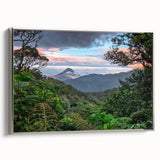 Framed canvas wall art showcasing a vibrant rainforest landscape design with silver edging, perfect for adding a touch of nature-inspired decor to any space.