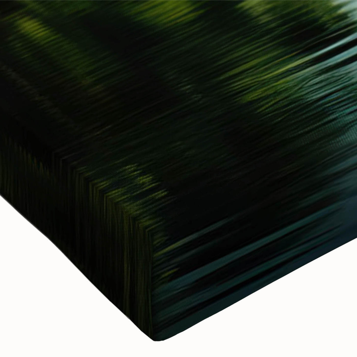 Close-up of a stretched canvas print showcasing a vibrant rainforest landscape design, featuring lush greenery and intricate details, perfect for home decor.