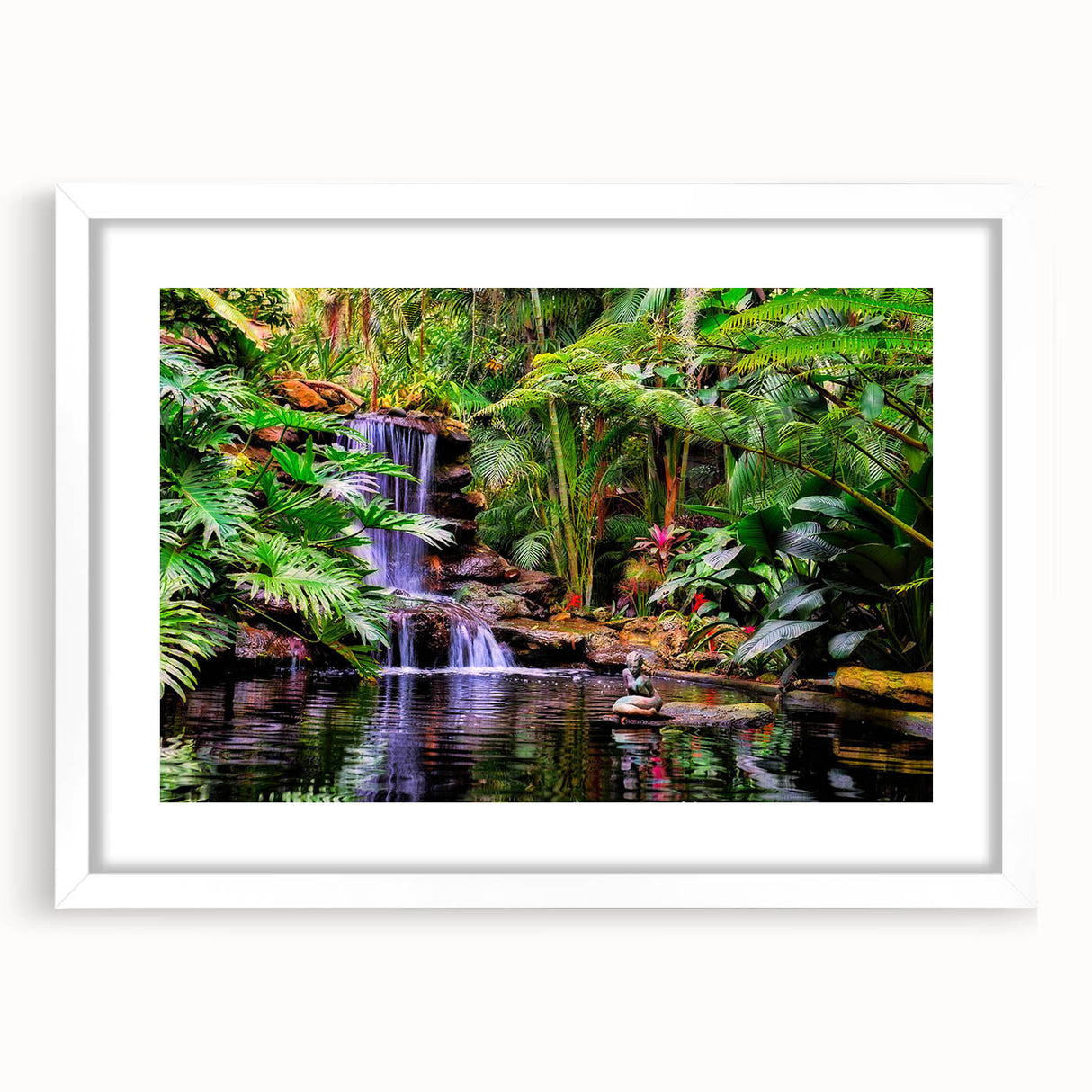 Framed rainforest landscape wall art in a white mat, showcasing vibrant green foliage and serene natural elements, perfect for home decor and nature enthusiasts.