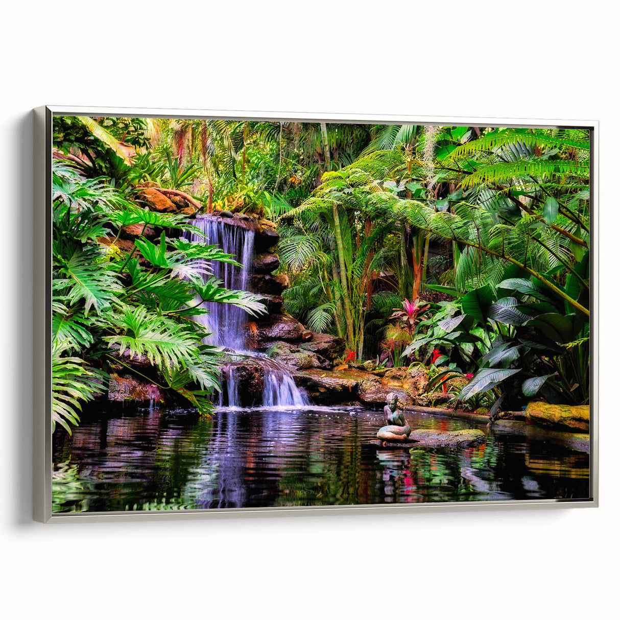 Framed canvas wall art depicting a vibrant rainforest landscape, featuring lush green foliage and a silver frame, ideal for enhancing modern home decor.